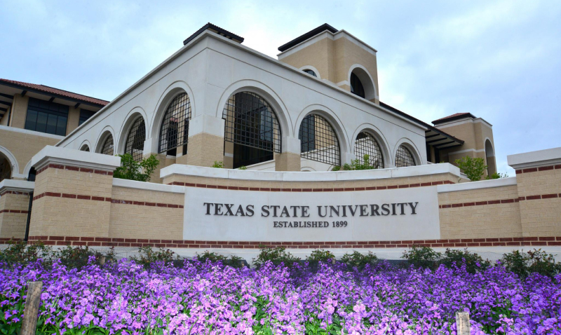 text state university sign flowerbed