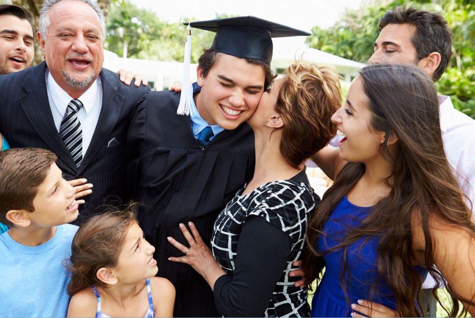graduate celebrates with family