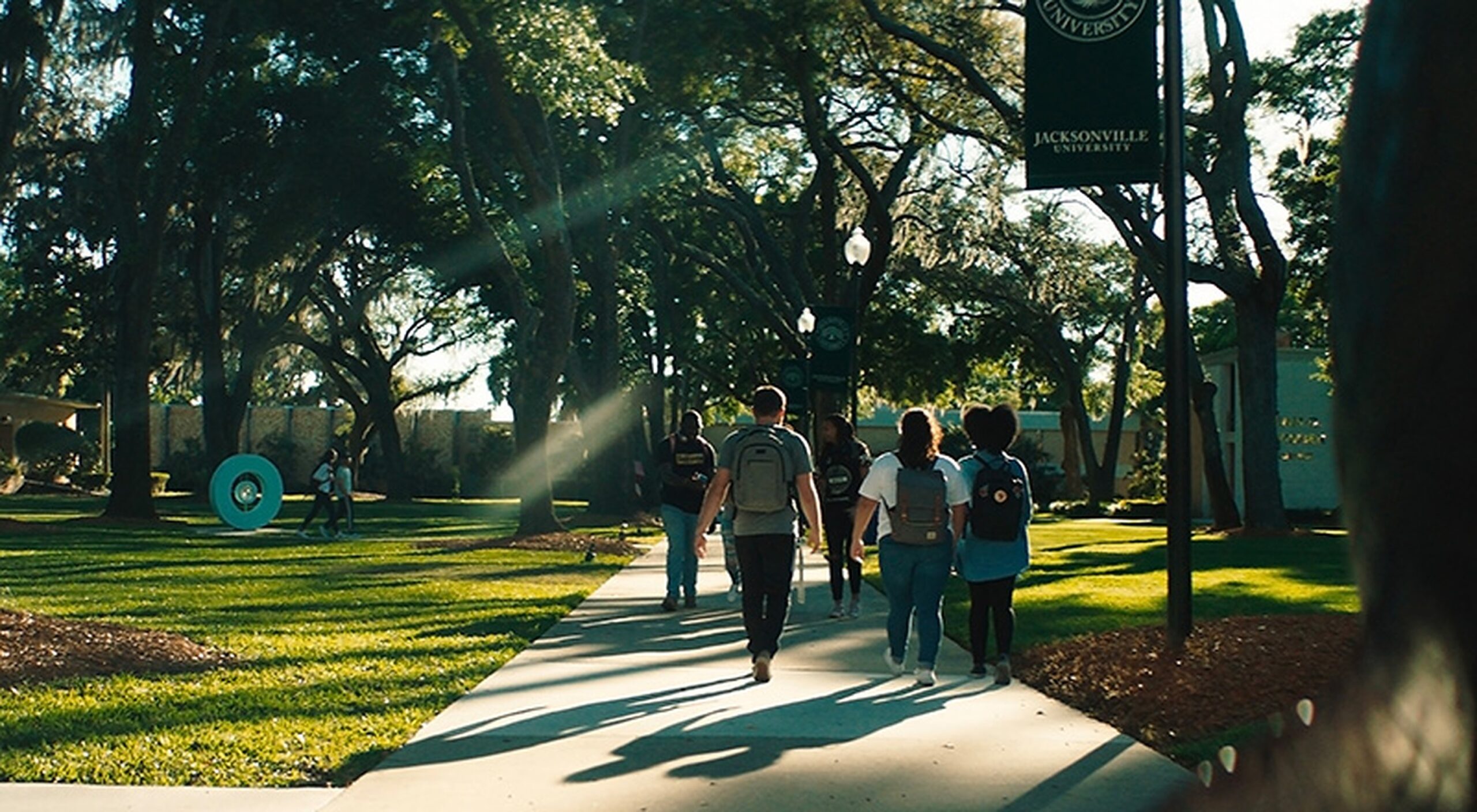 students outside walking on campus